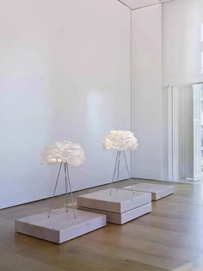 Cream decorbites cloud chandelier with delicate layered fabric shades on slender metal tripod for bedroom lighting