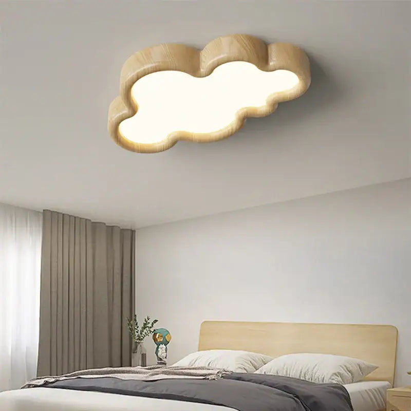 A warm softly glowing decorbites cloud led chandelier with natural wood finish for child room ceiling light