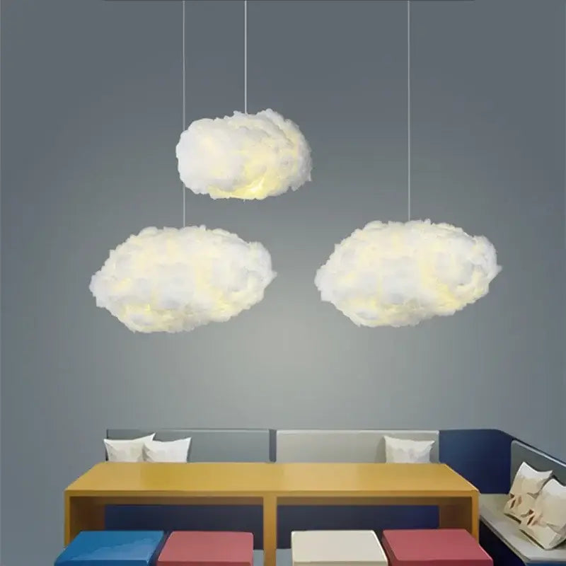 Three fluffy white decorbites cloud led pendant lights emitting a soft warm glow for bedroom illumination