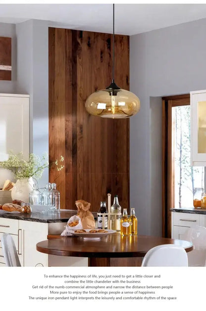 A sleek amber-tinted glass pendant light with black metal fixture from decorbites colorful led pendant lights for restaurant