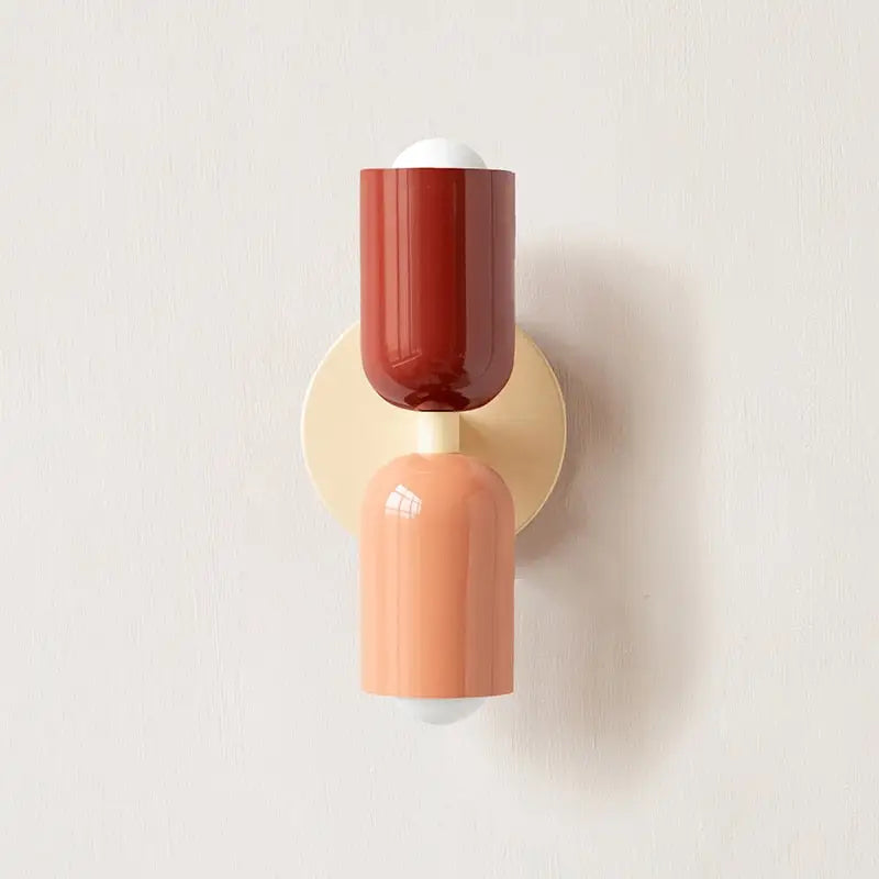 DecorBites modern wall sconce with glass shade features a glossy terracotta and peach two-tone design and cream backplate