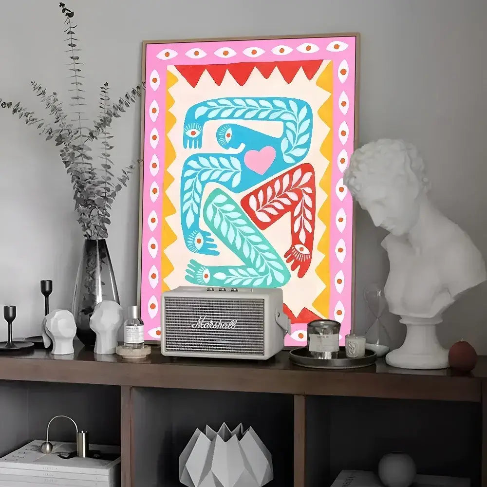 DecorBites™ vibrant pink and yellow framed wall art featuring stylized blue and red figures in a leopard vintage poster