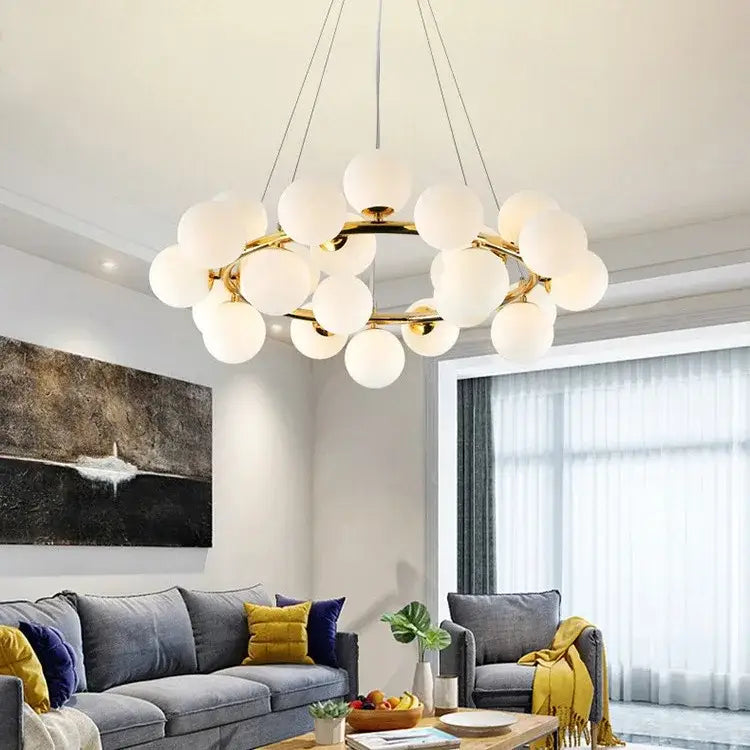 DecorBites™ contemporary black and gold chandelier with gold metal frame and multiple white glass ball shades