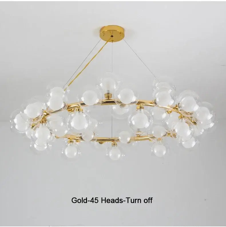 Decorbites™ contemporary black and gold chandelier with modern branching design featuring white glass ball bulbs