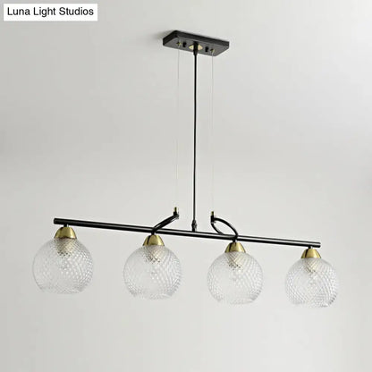 Contemporary black metal chandelier with clear prismatic glass globes and brass accents for dining hall lighting