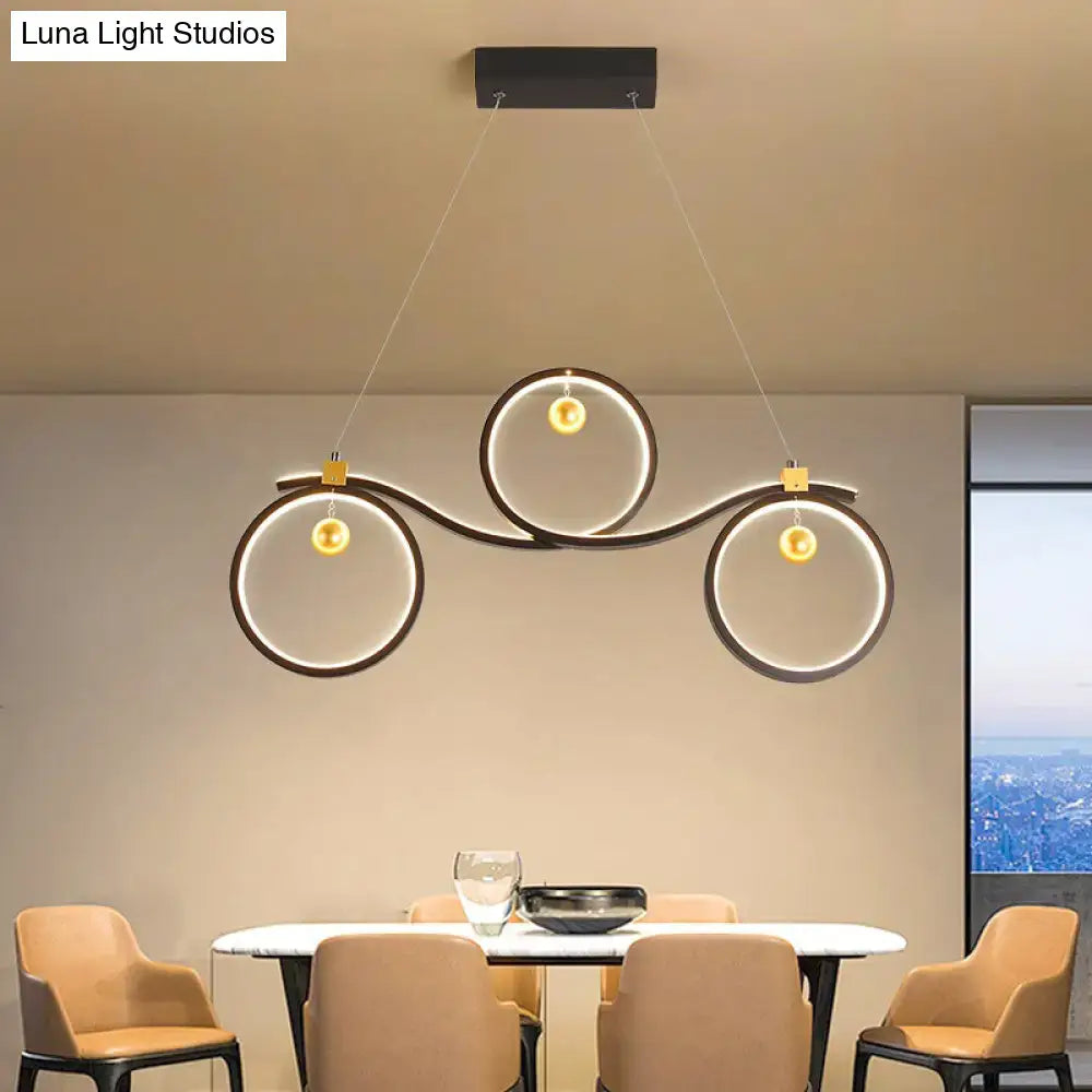 Decorbites contemporary black metal led pendant light with symmetrical rings island design and glowing gold accents