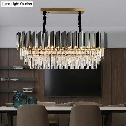 Modern rectangular DecorBites™ chandelier with gold metal frame, black silver panels, and crystal prisms for dining room