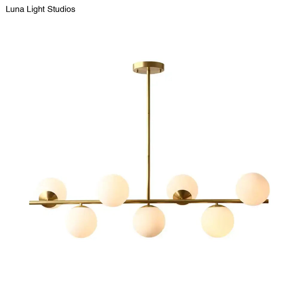 Decorbites™ contemporary brass pendant lamp with six frosted white glass globes in linear sphere island lighting design 220v-240v 110v-120v