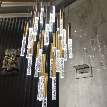 Decorbites™ contemporary crystal chandelier with gold-toned cylindrical frames and clear sparkling tubes for large staircase