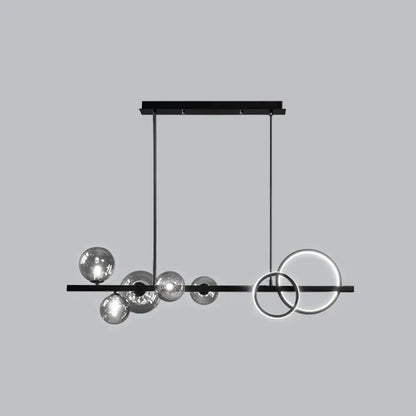 Modern black metal island lamp with sleek horizontal bar, hanging smoke grey glass spheres, and glowing circular rings