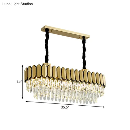Gold-toned decorbites™ oval island light with clear crystal droplets and LED bulbs on sleek metal frame