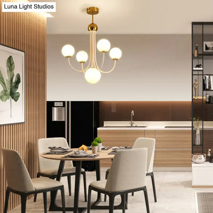 DecorBites™ contemporary gold glass spherical ceiling chandelier with five glass globes and central pendant lighting
