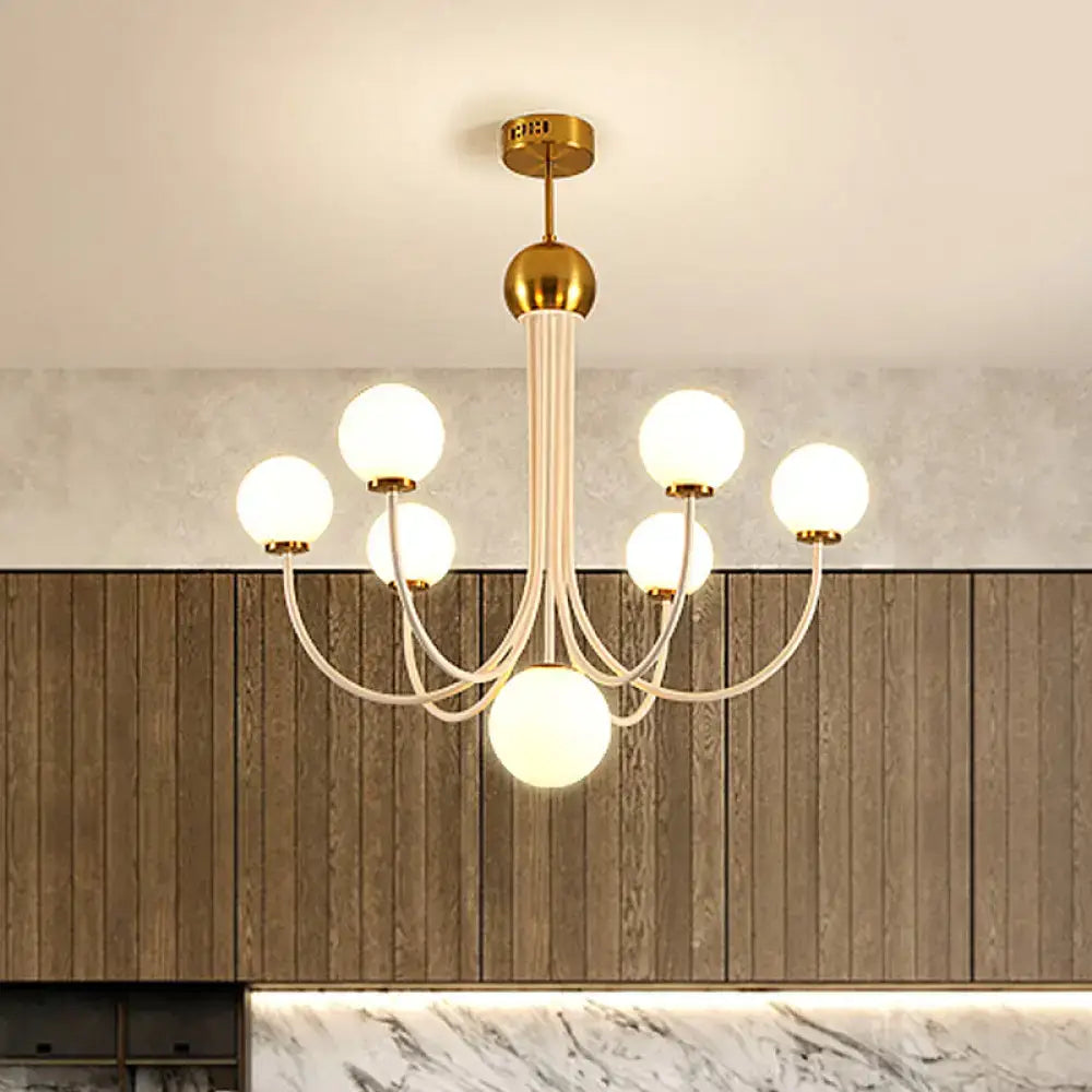 Gold-toned decorbites contemporary glass spherical ceiling chandelier with six frosted globe lights and white stem
