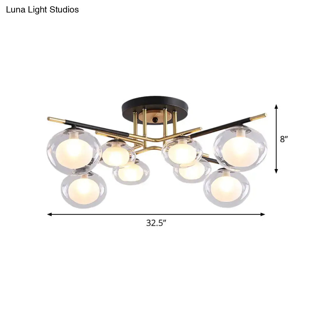 Decorbites semi-flush mount ceiling fixture with black base, gold metal arms, and clear glass oval shades for dining rooms