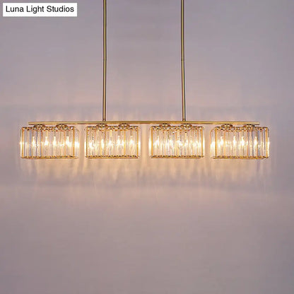 Decorbites™ contemporary gold pendant lighting featuring a clear cuboid crystal shade with warm glowing led incandescent fluorescent lights