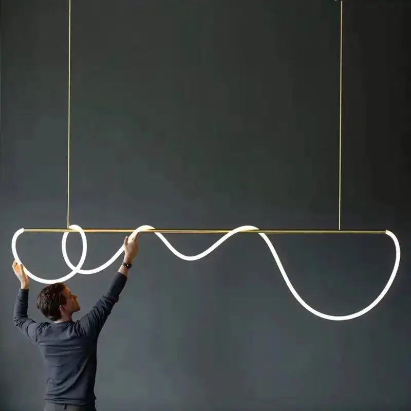 A decorbites™ contemporary led chandelier with a gold frame and white glowing long hose led for dining room lighting