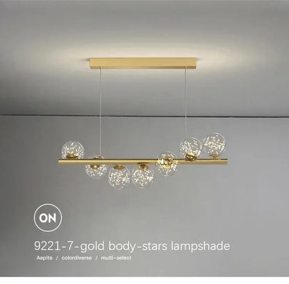 DecorBites™ contemporary led glass ceiling chandelier with gold-toned bar and seven clear globe shades with star sparkles