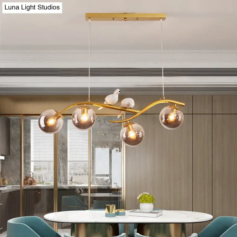 DecorBites contemporary metal branch pendant lamp with gold tone, smoke grey cognac glass shades, and white bird decor