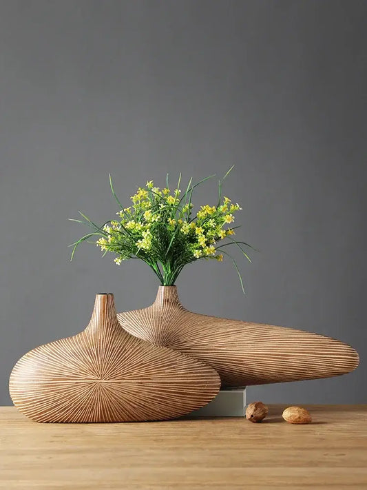 Two sleek light-brown wooden vases with radial grooves showcasing decorbites contemporary resin vase design