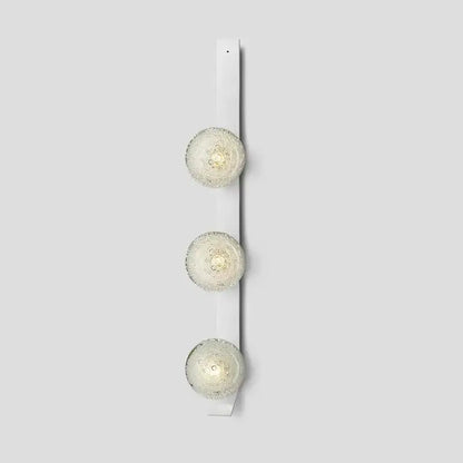 DecorBites™ contemporary wall light with three frosted glass globe bulbs mounted on a white fixture