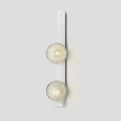 White DecorBites™ contemporary wall light with two frosted bubble-textured glass globe shades mounted on wall