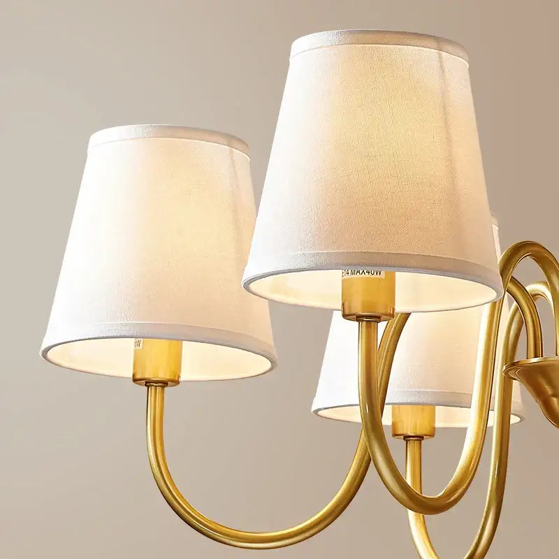 Gold-toned decorbites copper american chandelier with three off-white fabric lampshades for living room lighting