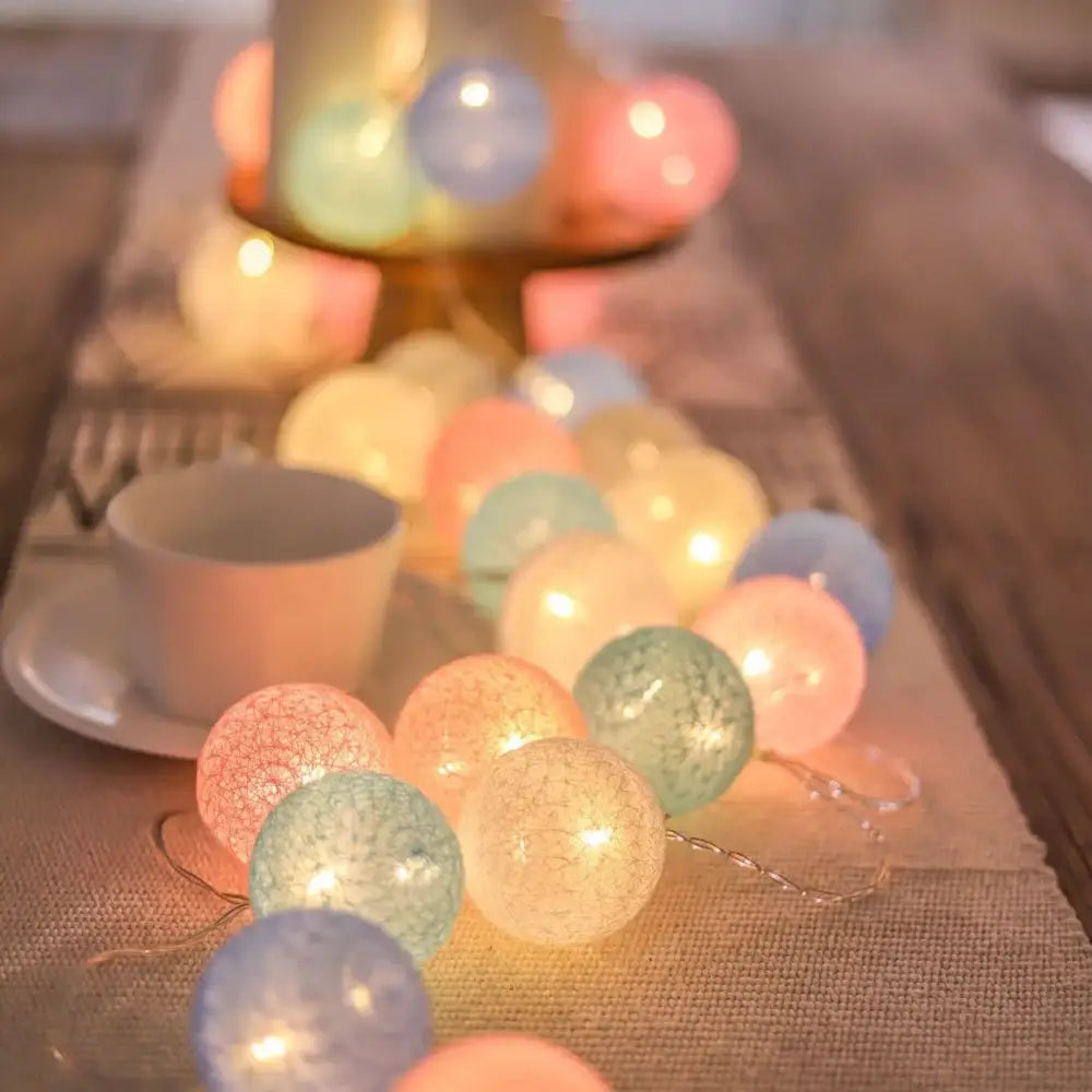 Decorbites cotton garland led string lights featuring pastel crackled glass globes with a warm glow for home decor