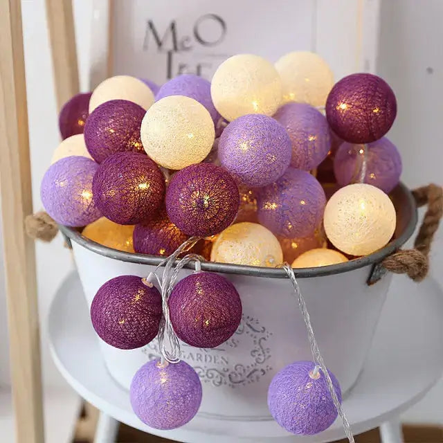 DecorBites™ cotton garland led string lights featuring purple and cream spherical cotton garland with fabric texture
