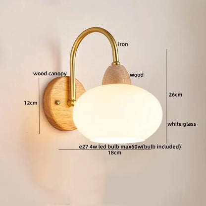 Decorbites cotton led wall lamp with brass arm, natural wood canopy, and white oval glass shade for bedroom use