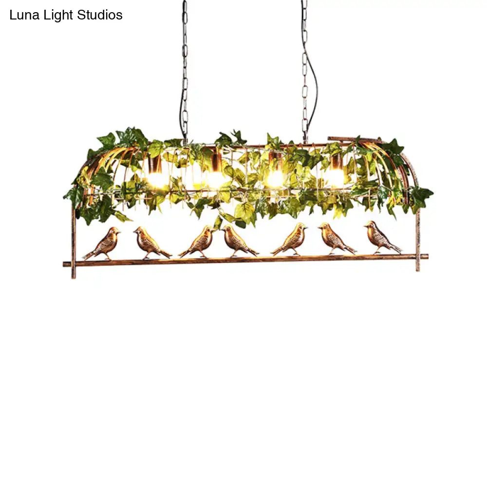 A bronze birdcage island light fixture with six detailed birds and faux ivy for rustic bar suspension lighting