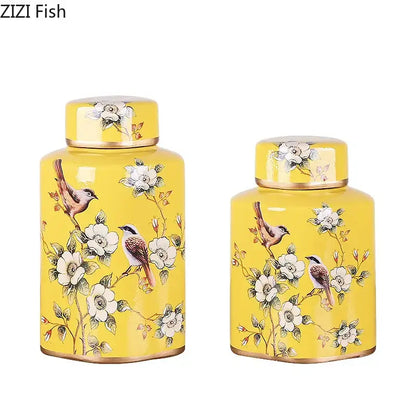 Vibrant yellow decorbites country ceramic tea caddies with hand-painted white blossoms and gold-trimmed lids and bases