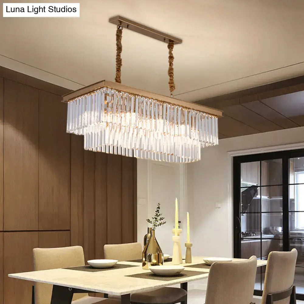Rectangular gold-toned metal chandelier with clear crystal prisms and twisted rope chains for country dining room light kit