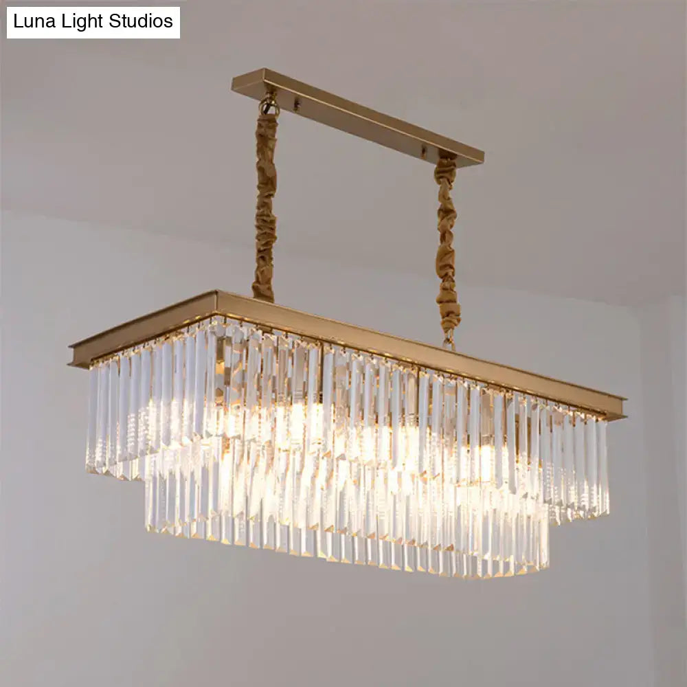 Gold-toned rectangular chandelier with cascading clear crystal prisms and twisted rope chains for country dining room light kit