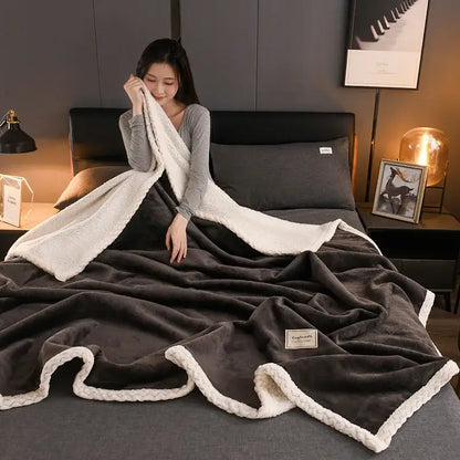 A decorbites cozy autumn gray and white plush blanket with dark gray exterior and soft white fleece interior trim