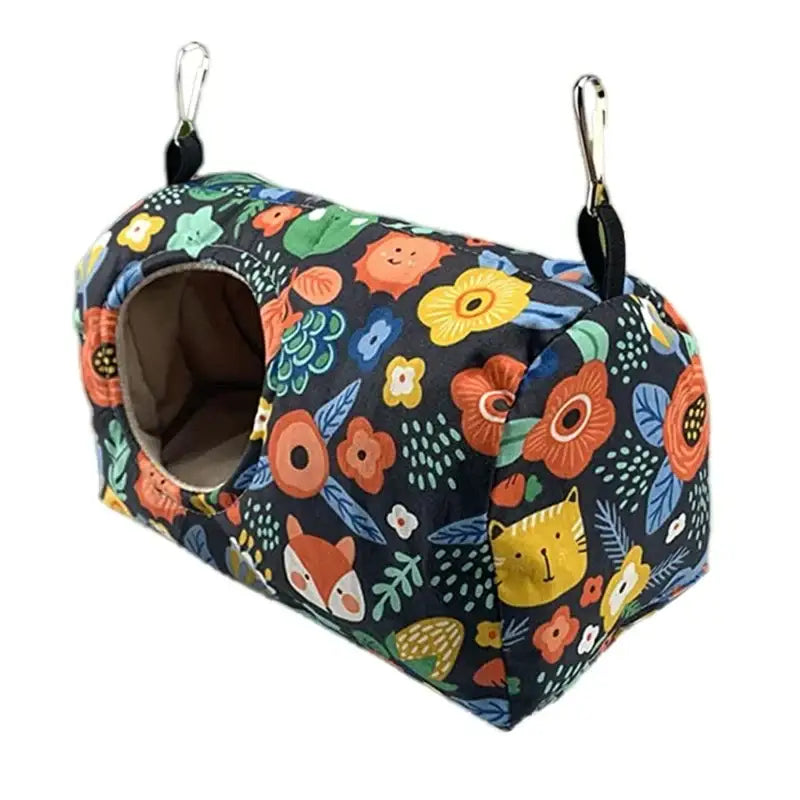 Decorbites cozy hanging hammock for small pets with vibrant floral and animal print on dark fabric for warm bird use