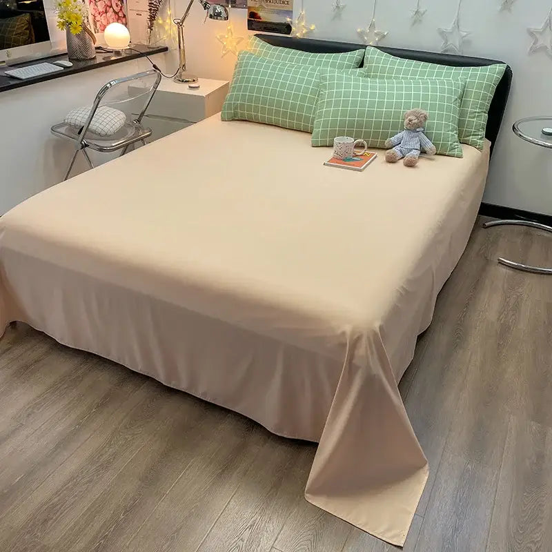 Beige satin bed sheet with smooth flowing drape and tucked edges from decorbites cozy nordic plaid 1pc flat sheet set