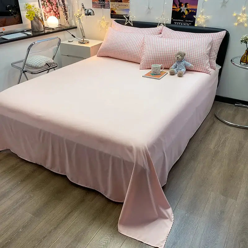 Pink satin bed sheet with ruffled hem as part of decorbites cozy nordic plaid 1pc duvet cover bedding set queen king size