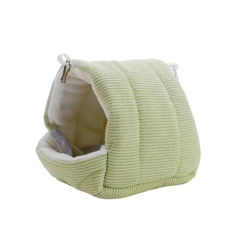 Light green corduroy DecorBites™ cozy parrot cage hanging hut bed with white lining and silver metal hooks for bird cage parrot use