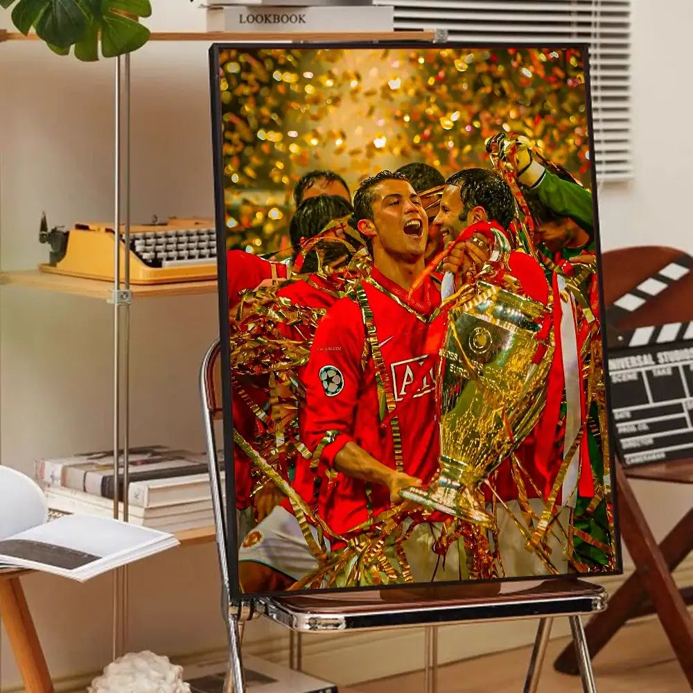 A framed decorbites™ cr7 self-adhesive art poster of cristiano ronaldo in a red jersey with champions league trophy for home decor