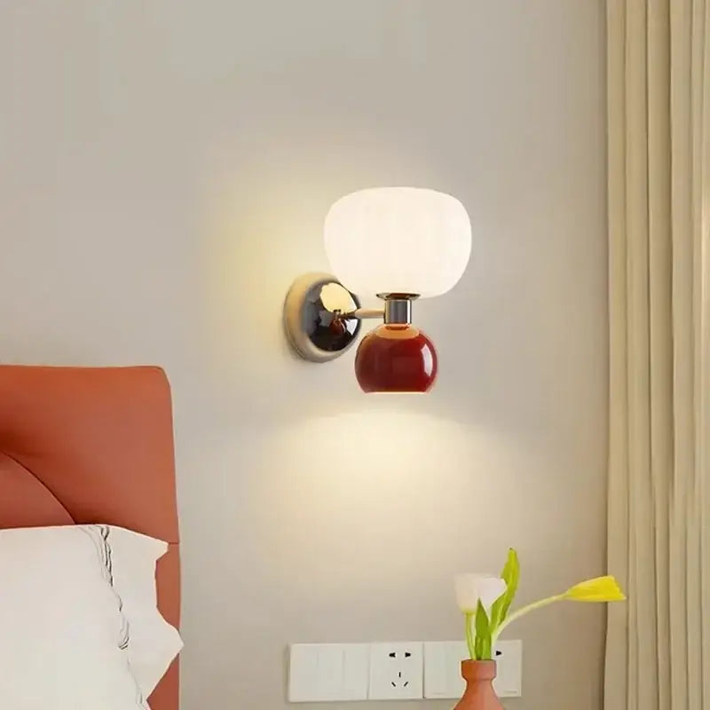 Decorbites cream breeze frosted glass pumpkin wall sconce with glossy white glass shade and red ceramic base for bedroom lighting