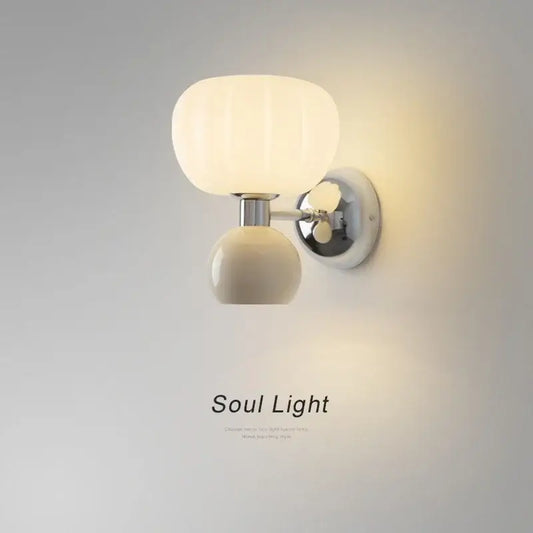 Creambites cream breeze frosted glass pumpkin wall sconce with cream-colored globe and polished chrome bracket for bedroom lighting