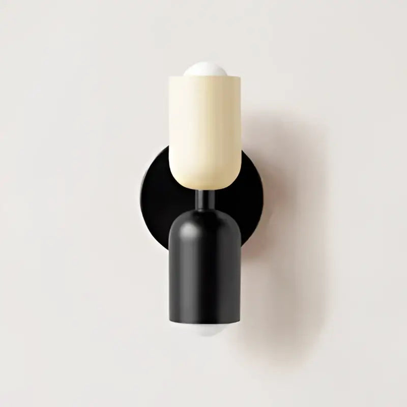 Cream double head wall lamp by decorbites featuring cream cylindrical shades and black modern base for bedroom use