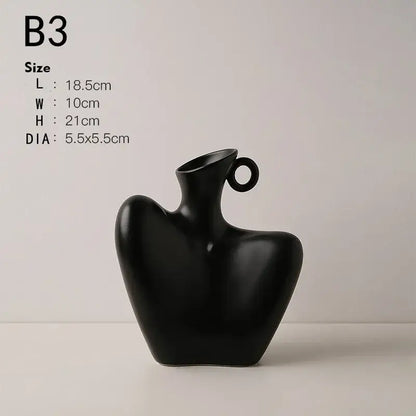 Black ceramic human vase with sleek abstract design and circular handle for modern home decor by DecorBites™