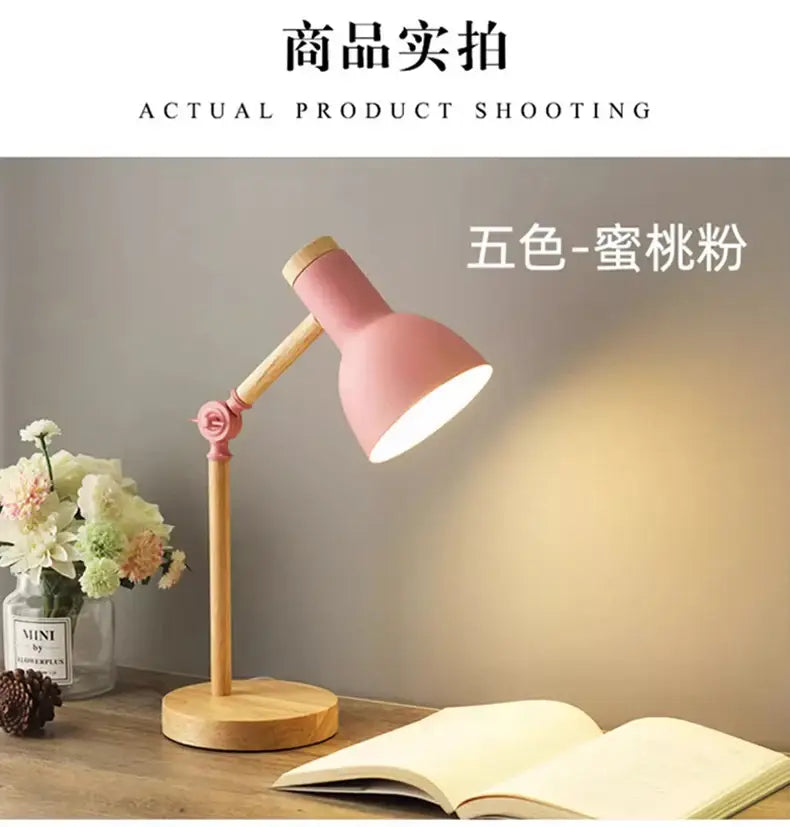 Pink and wood-toned creative nordic table lamp with adjustable arm and rose-colored joint for bedside or study use