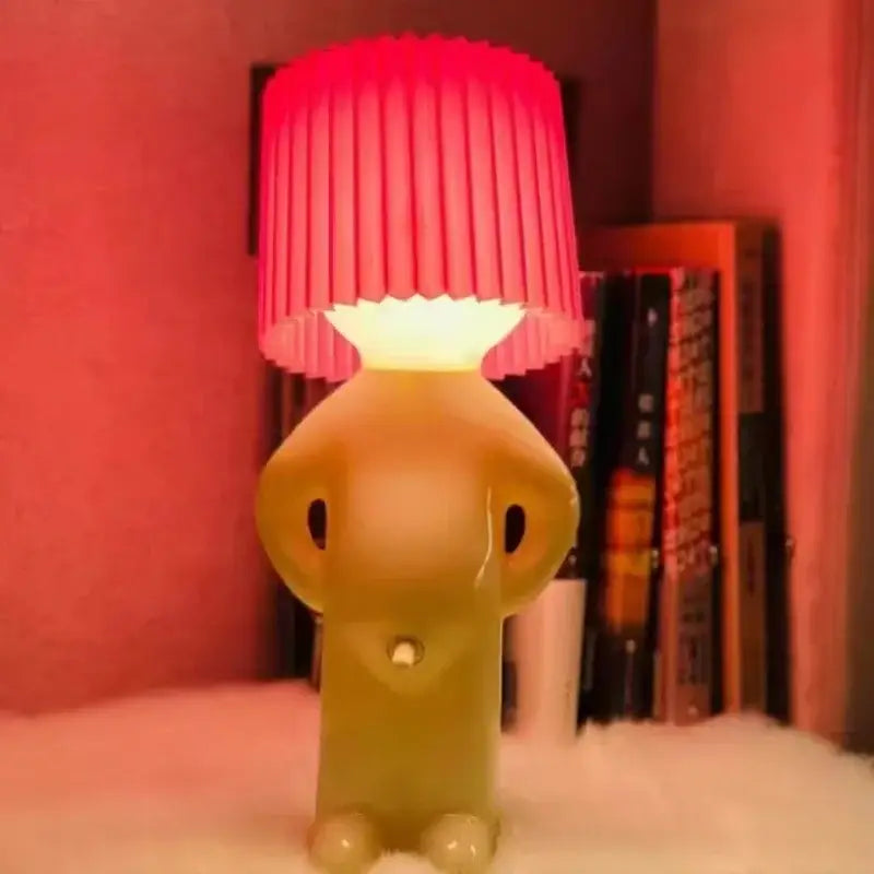 DecorBites creative table lamp featuring a translucent yellow elephant base and vibrant red pleated shade for bedside use