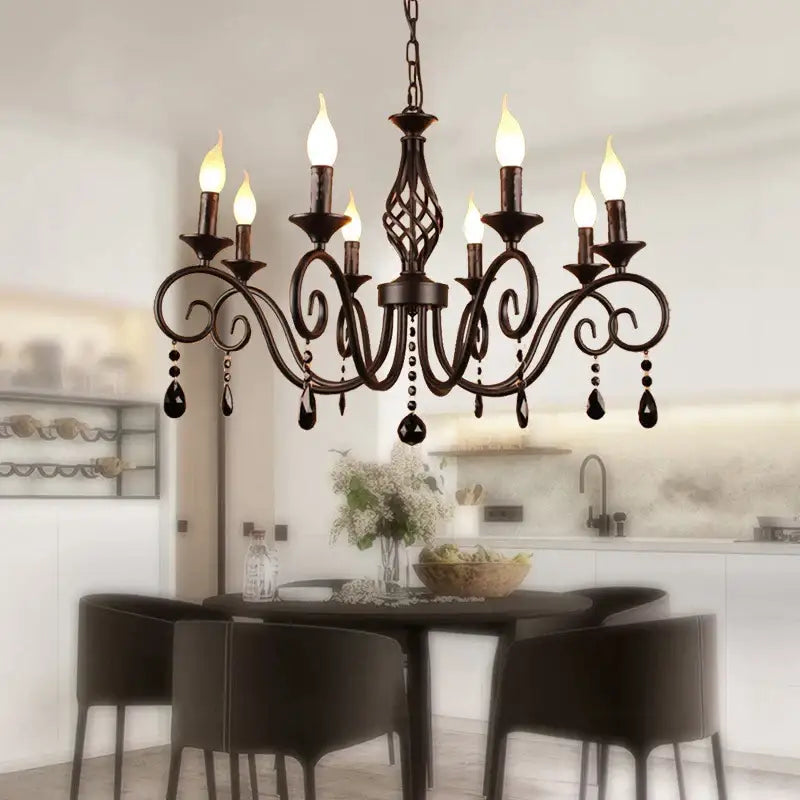 Black wrought iron decorbites crystal black chandelier with ornate scrollwork and teardrop crystals for dining room
