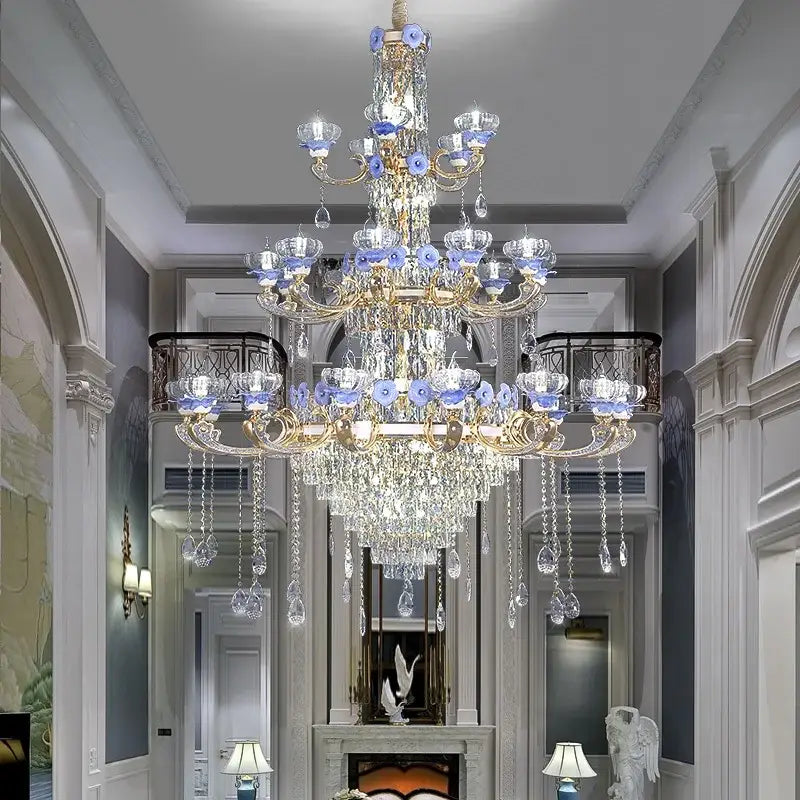 Decorbites crystal candle chandelier featuring gold-toned metalwork blue glass accents and clear crystal droplets for living room lighting