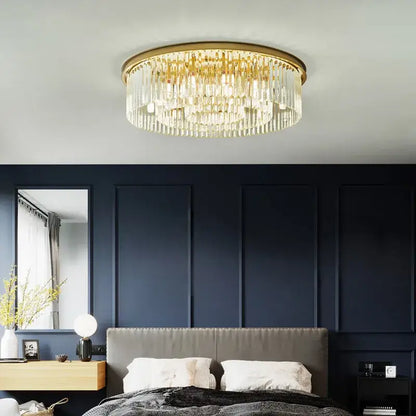 Gold-toned decorbites crystal ceiling chandelier with cascading clear crystal prisms for living and dining rooms