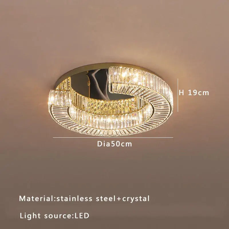 Decorbites crystal ceiling lamp featuring a modern circular design with clear crystal and gold-toned stainless steel accents