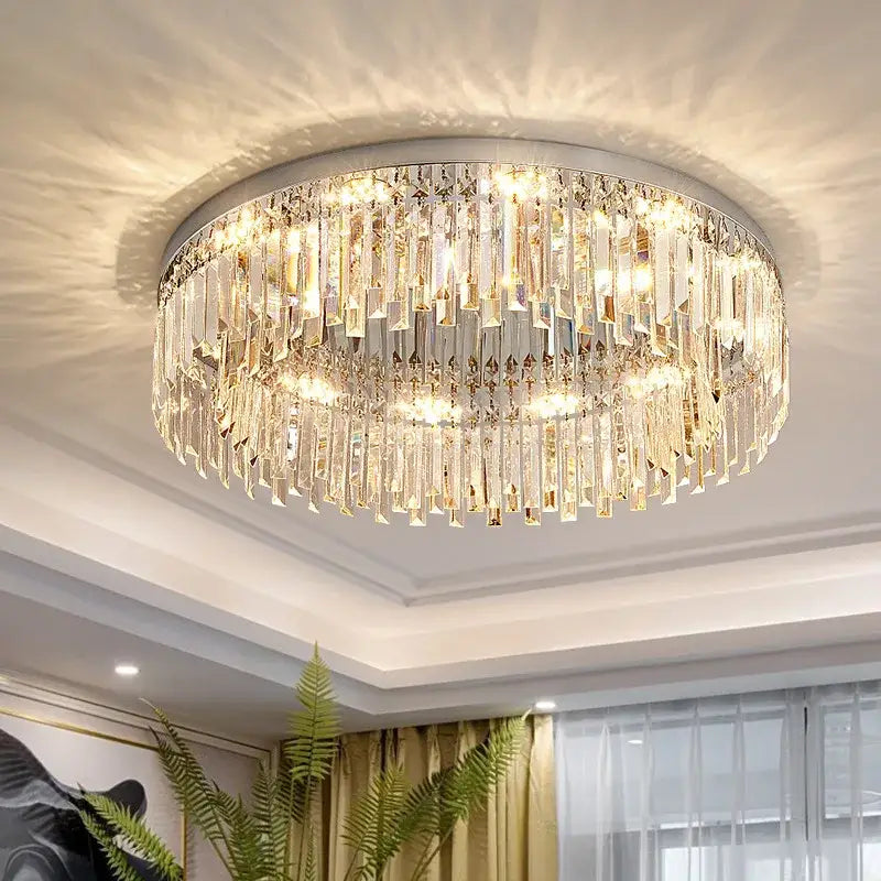 DecorBites crystal ceiling lamp with sleek chrome frame and clear glass prisms emitting warm golden light